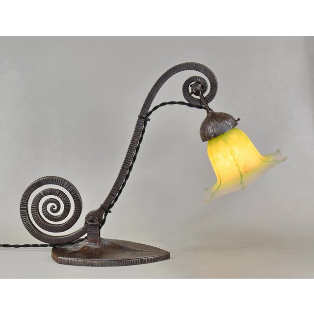 Daum frères A wonderful French 1925 art deco lamp in wrought iron. The heavy forged base of excellent quality holds a rare...
