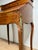 Elegant French secretary desk in Louis XV style, featuring a graceful slant-front form raised on slender cabriole legs....