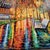 Impressionist style original oil painting on canvas, done with a pallet knife, vibrantly colored street scene of a lone...