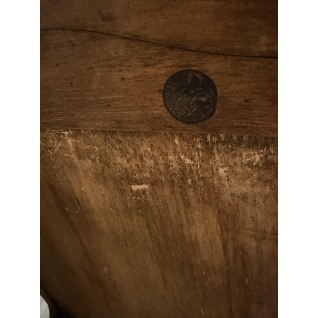 A Louis XV style walnut wine cooler, stamped Mailfert, with a drawer in the front, resting on four cabriole legs joined by...