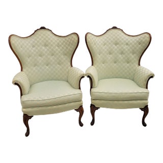 Pair of Mid-Century French Louis XV–Style Carved Walnut Wingback Chairs For Sale