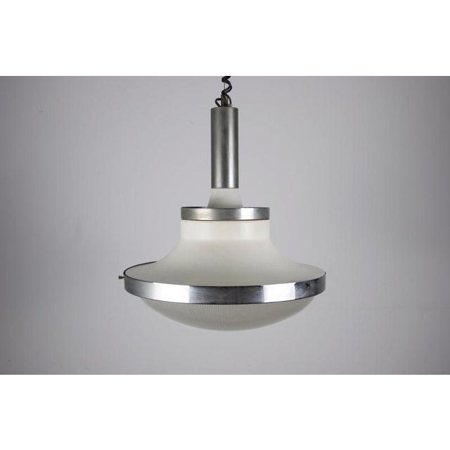 Italian ceiling lamp from the 1960s in the style of sergio mazza and early artemide lighting. The piece has a strong...