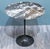 Eero SAARINEN (1910-1961), Edition Knoll: Pedestal table in circular black marble with beige and white veins, Aluminum...