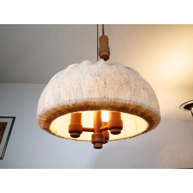 Danish Design Lamp from Domus. The ceiling lamp is made of teak and fabric. The umbrella can be adjusted in height by...