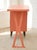 A playful vintage single pedestal desk finished in a warm peach tone. The streamlined rectangular work surface is...