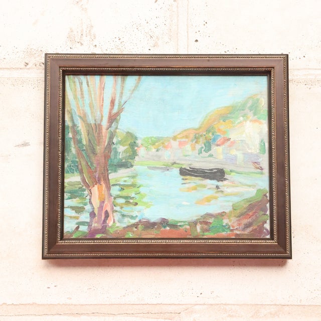 20th Century French Spring River Painting captures a light-filled riverside scene with a soft, impressionistic touch and a...