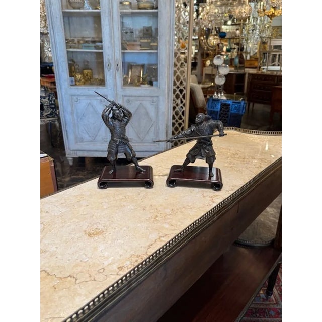 Pair of 19th century Japanese bronze fighting Samurai warriors on stands. Circa 1880. A timeless and classic touch for a...