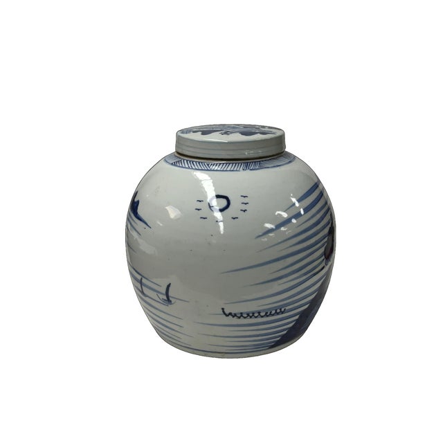 This ceramic ginger jar features a classic globular body decorated in a traditional underglaze cobalt blue and white...