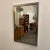 Mid Century Modern vintage Mirror in the style of Paul Evans The mirror is in vintage used condition. The mirror has...