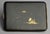A Japanese Komai style damascene cigarette case with richly detailed gold inlay on blackened steel, featuring a different...