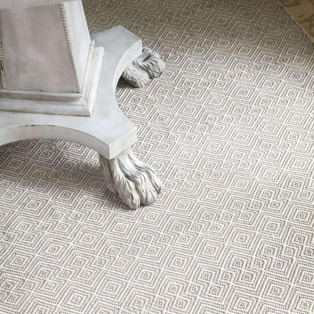 This clever take on a classic diamond pattern in a durable, washable indoor/outdoor jacquard weave made of recycled...