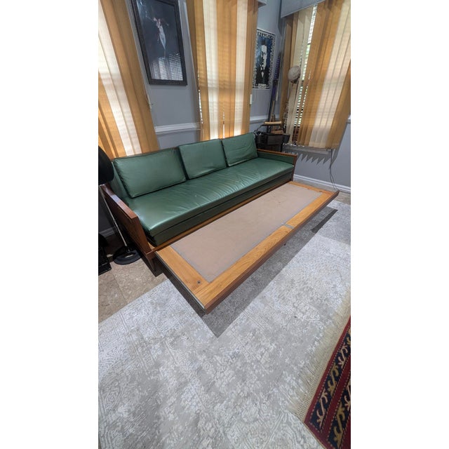 Absolutely gorgeous genuine MCM mid century modern emerald green wood and vinyl couch with rattan sides. Pulls out to a 2...