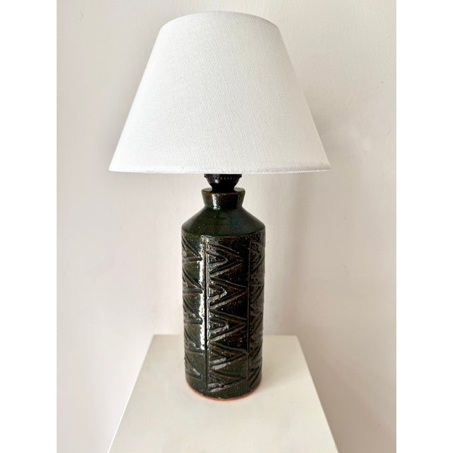 Pair of stylish vintage Swedish stoneware table lamp foots in deep green glaze, with geometric relief designed and...