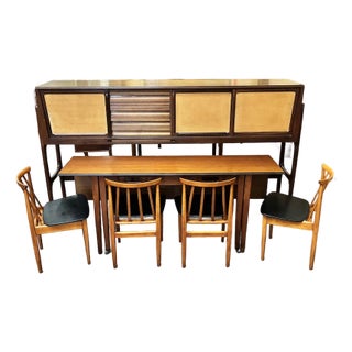 Iconic European Mid Century Modern Teak & Wicker Nesting Dining Suite W/ Credenza, Dining Table & Four Chairs c.1960 For Sale