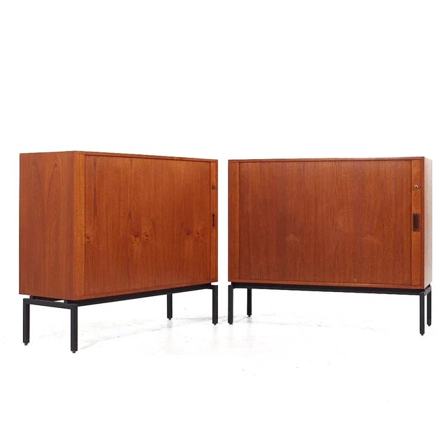 Mid Century Danish Teak Tambour Door Credenza - Pair Each credenza measures: 43.25 wide x 15.75 deep x 37.25 inches high...