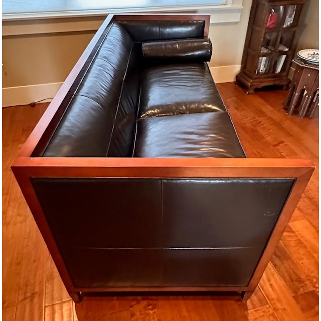 Baker Furniture is known for timeless design and unsurpassed quality and craftsmanship. This black leather sofa is from...