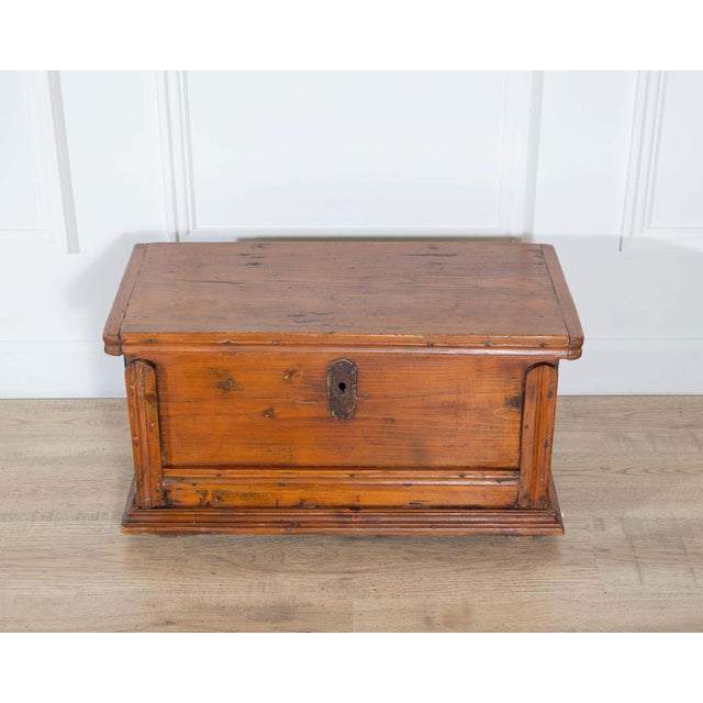 A small 18th-century travel box from Tuscany, crafted in fir wood with a warm, naturally aged patina. Compact in scale yet...