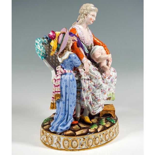 Exceptional meissen porcelain genre group: young mother seated on a magnificent louis xvi-style armchair, her left foot...