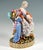 Exceptional meissen porcelain genre group: young mother seated on a magnificent louis xvi-style armchair, her left foot...