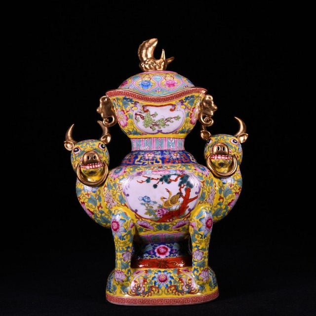 A magnificent and elaborately decorated Chinese porcelain Zun vase featuring a vibrant yellow ground. The vase is heavily...