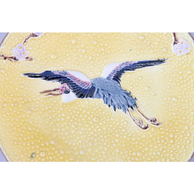 A rare antique yellow majolica flying crane plate by Joseph Holdcroft, Longton, England, circa 1870. Maker's mark on...