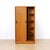 This vintage mid-century armoire was produced by Austinsuite Furniture during the 1960s. Made from teak the two front...