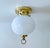 Vintage Limburg flush light, featuring globe glass shade mounted on a brass base with ring finial. Very good condition....