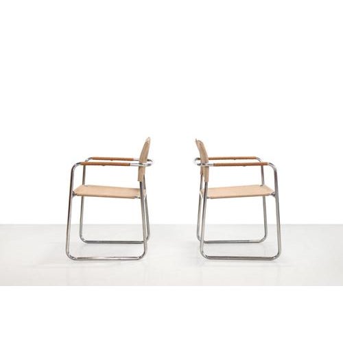 Set of two chrome tubular frame chairs designed by Karin Mobring in 1973. Karin Mobring designed the Amiral chair in 1969...