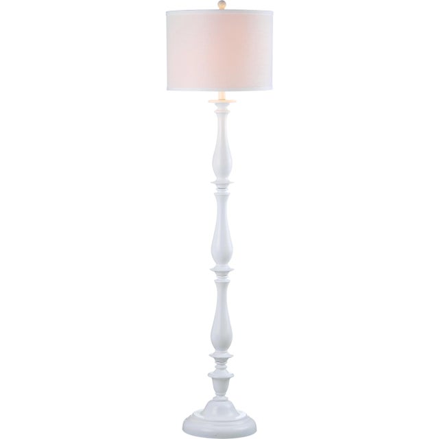 Material culture. The sleek white curves of the candlestick floor lamp are a urban spin on a traditional style. it's...