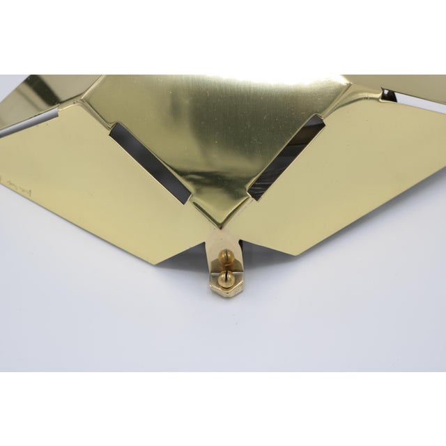 Pair of Gabriella Crespi brass sconces. Polished brass with single edison socket in each. Signed on the side.