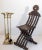 A sophisticated vintage French solid brass fireplace tool set, circa 1940s, distinguished by four beautifully modeled...