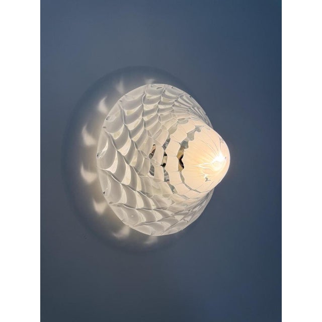 Italian mid-20th-century modern ceiling light, a striking piece that emphasizes the beautiful interplay of light created...