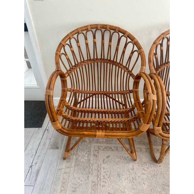 Beautiful pair of vintage rattan lounge chairs. Sure to make a statement!