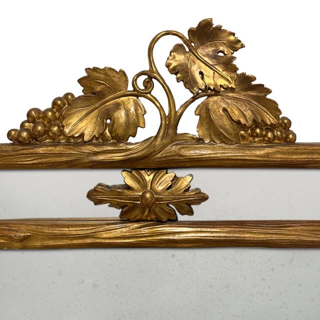 This beautiful naturalistic giltwood mirror was made in France in the 19th century. Retains the original, lightly foxed,...