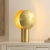 Illuminate your space with the Frey table lamp, a stunning 15 inch piece crafted from brass metal. This lamp is the...