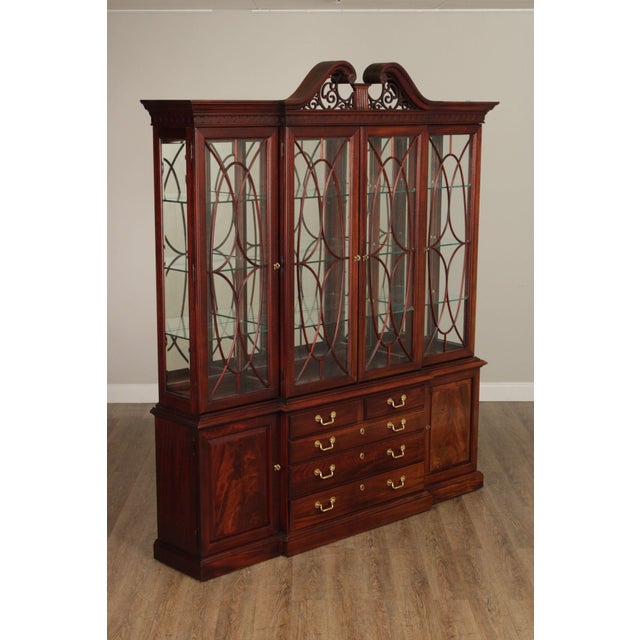 High Quality Mahogany Breakfront Bookcase with Carved Scrollwork Pediment, Four Glazed Doors Opening to Lighted Interior...