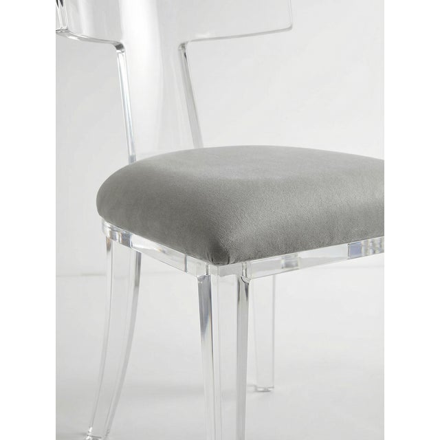 A fresh take on a classic silhouette, the Tristan Chair by Interlude Home pairs clear acrylic construction with a plush,...