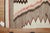 An early 20th-century high-decorative American Navajo rug featuring a pattern resembling a sharks tooth in gray, ivory and...