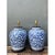This vintage pair of monumental ceramic ginger jar table lamps brings timeless blue and white elegance to any room....