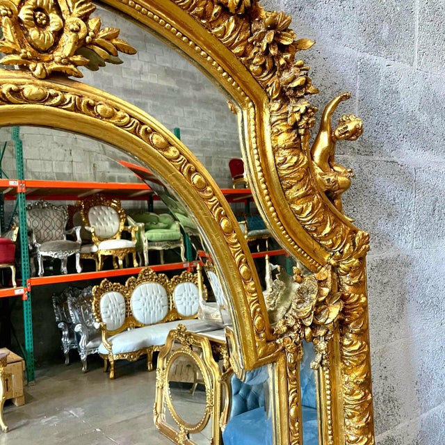 This Baroque Rococo floor mirror is an exceptional statement piece that showcases fine craftsmanship and timeless European...