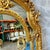 This Baroque Rococo floor mirror is an exceptional statement piece that showcases fine craftsmanship and timeless European...