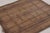 Made with handwoven reed and camel leather in Mauritania circa 1950-1960, this 4x4 vintage square Tuareg mat is an...
