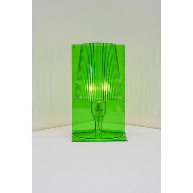 The iconic take table lamp, designed by ferruccio laviani for kartell in 2003. a celebrated example of contemporary...