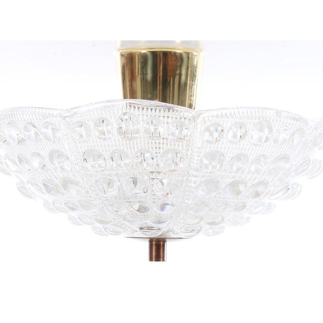 This Mid century modern ceiling lamp was designed by Carl Fagerlund in the 1960s and produced in Sweden in the same period...