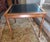 Gorgeous, vintage Hollywood Regency card/game table featuring a stunning faux bamboo wood frame and a premium inset gold...