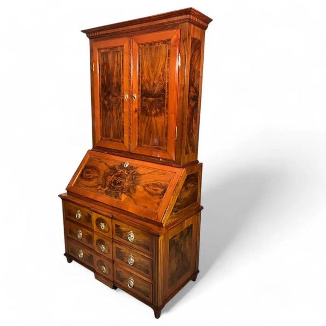 This remarkable Louis XVI Secretary Cabinet, crafted in South Germany around 1780, showcases a sophisticated blend of...