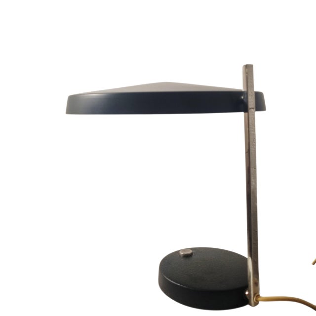 The Oslo was designed by Heinz Georg Pfaender in 1961 and is one of Hillebrand’s characteristic early-1960s table lamps....