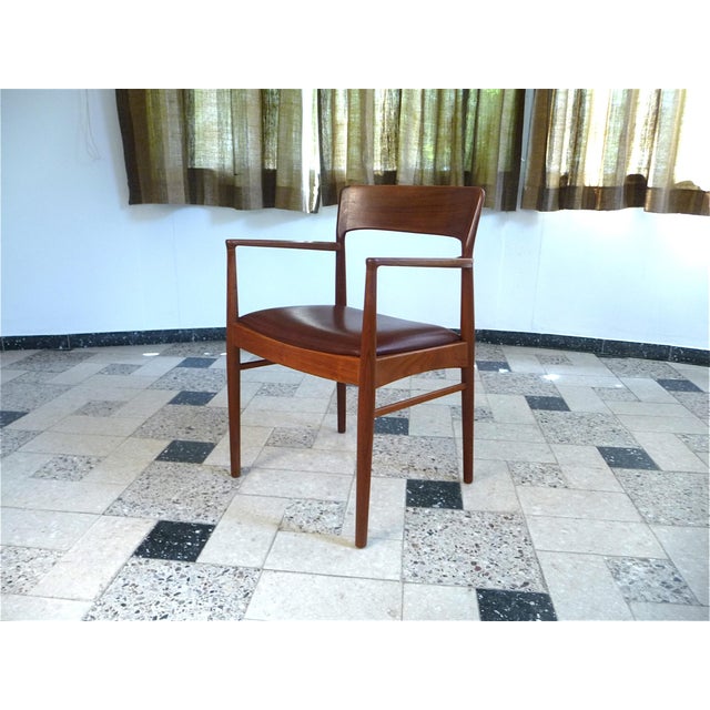 This pair of high-quality armchairs was designed by Henning Kjaernulf for by Korup Stolefabrik in Denmark during the...