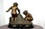 A french bronze of 3 young boys up to mischief. H 14 in. X w 14 in. X d 14 in. H 35.56 cm x w 35.56 cm x d 35.56 cm