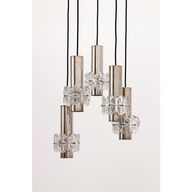 This is a hanging lamp with 5 lamps distributed over a round ceiling pendant. We have provided new cabling according to...